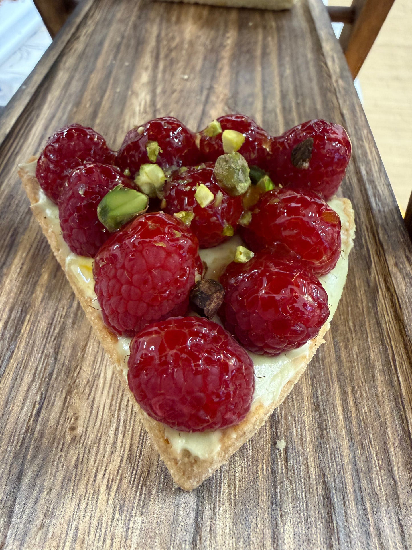 Raspberry and pistachio tart